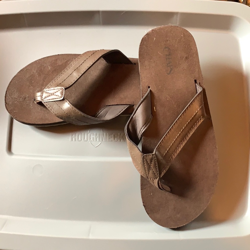 Never worn brown flip flops!